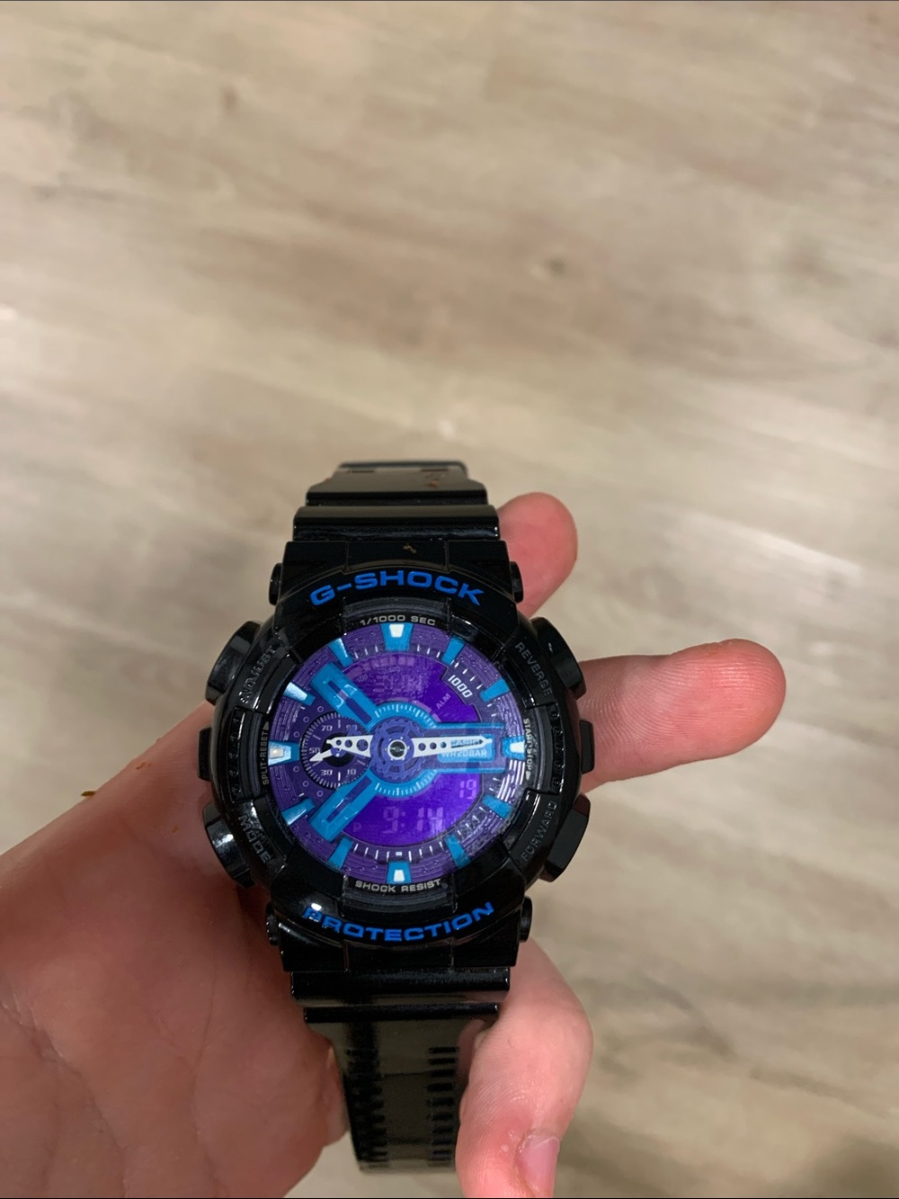 G-Shock Black Watch with Purple Dial and Blue Accents